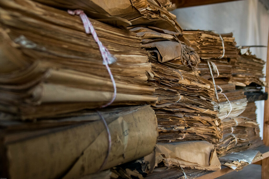 Stacks of old papers and letters left behind, waiting to be sorted